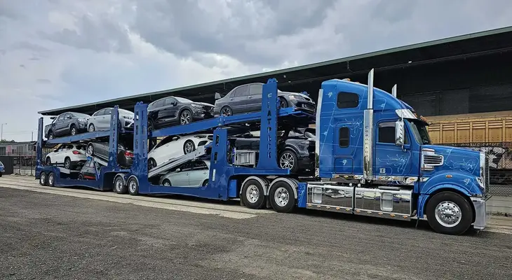 An auto carrier with multiple cars on it