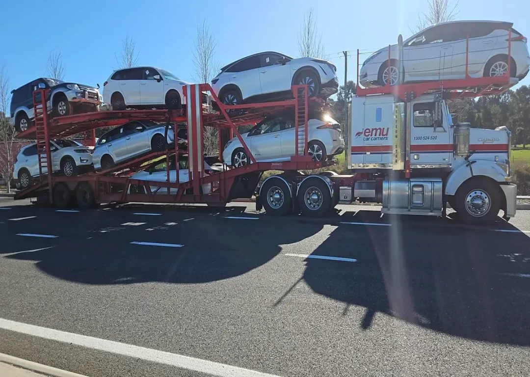 A car trailer carrying cars on it